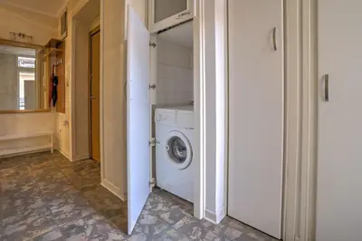 a laundry room with a washer and dryer at Kalemegdan Central Apartment II in Belgrade