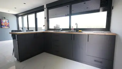 a kitchen with a sink and a window at River House Sunrise in Ritopek