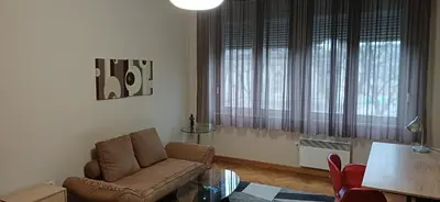 a living room with a couch and a table at LP apartment in Belgrade