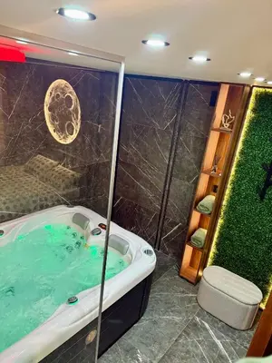 a bathroom with a tub and a shower at Moon Apartment Belgrade in Belgrade