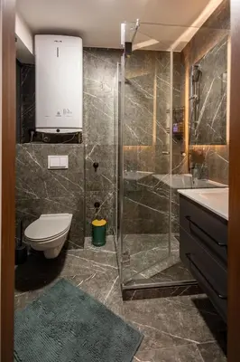 a bathroom with a shower and a toilet and a sink at Moon Apartment Belgrade in Belgrade