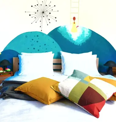 a bedroom with a bed and a clock on the wall at Villa K Apartments in Belgrade