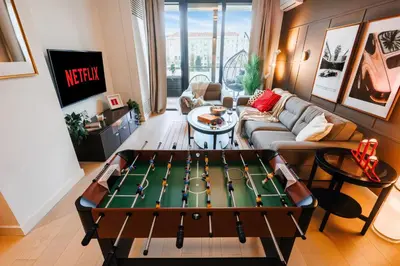 a living room with a ping pong table at WF Timeless Residence with Terrace & Foosball in Belgrade