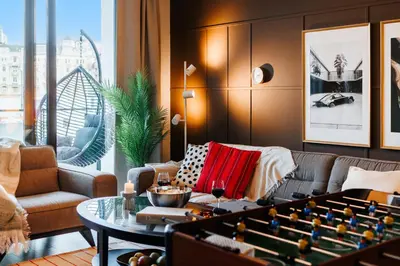 a living room with a couch and a foos ball at WF Timeless Residence with Terrace & Foosball in Belgrade