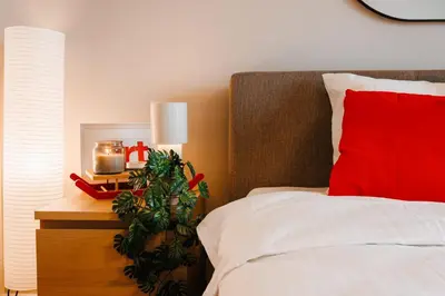a bedroom with a christmas tree next to a bed at WF Timeless Residence with Terrace & Foosball in Belgrade