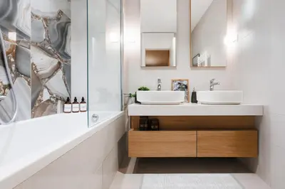 a bathroom with two sinks and a shower at WF Timeless Residence with Terrace & Foosball in Belgrade
