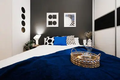a bedroom with a bed with a basket on it at Foosball Frontyard Retreat Old Town in Belgrade