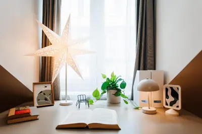 a desk with an open book and a star on it at Foosball Frontyard Retreat Old Town in Belgrade