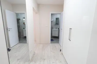 an empty room with white walls and a mirror at Old Town Lounge Belgrade in Belgrade