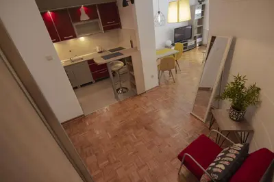 an overhead view of a kitchen and a living room at Slavija Square Apartments in Belgrade