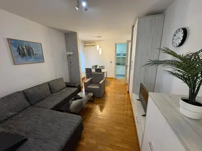 a living room with a couch and a table at Apartment Zumbul 85 in Belgrade