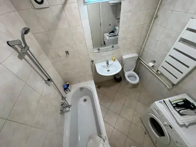 a bathroom with a tub and a sink and a toilet at Apartment Zumbul 85 in Belgrade