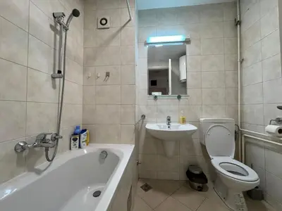 a bathroom with a tub and a toilet and a sink at Apartment Zumbul 85 in Belgrade