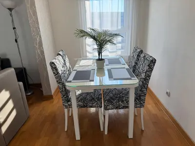 a dining room table with a potted plant on it at Apartment Zumbul 85 in Belgrade