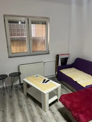 a living room with a couch and a coffee table at Apartman Jovanović in Belgrade