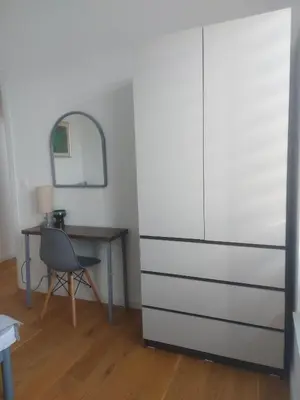 a room with a desk and a white refrigerator at Danube Riverfront 8 in Belgrade