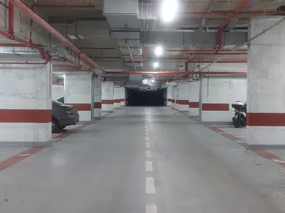 an empty parking garage with a car parked in it at Danube Riverfront 8 in Belgrade