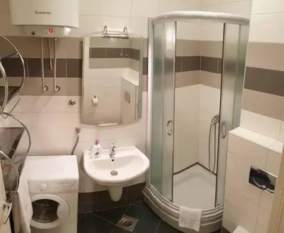 a bathroom with a shower and a sink at Apartment Theatre in Belgrade