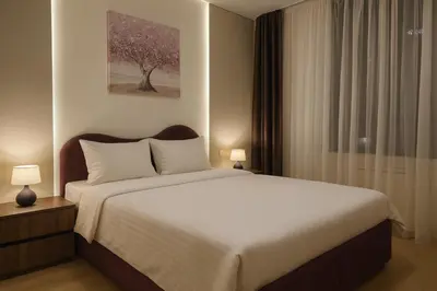 a bedroom with a large bed and a window at Belgrade Waterfront Premium LuX Apartment in Sajmište
