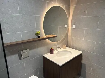 a bathroom with a sink and a mirror at Belgrade Waterfront Premium LuX Apartment in Sajmište