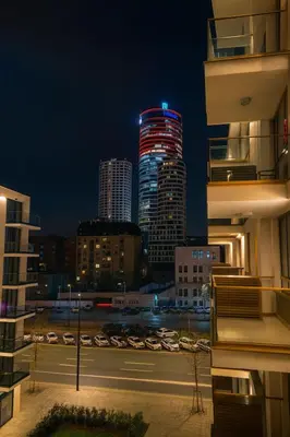 a night view of a city with tall buildings at Belgrade Waterfront Premium LuX Apartment in Sajmište