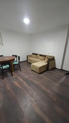 a living room with a couch and a table at Čiča 1 in Dobanovci