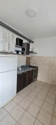 a kitchen with a sink and a counter top at Čiča 1 in Dobanovci