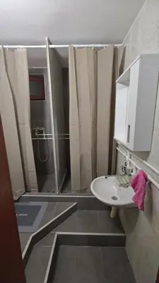 a bathroom with a sink and a shower at Čiča 1 in Dobanovci