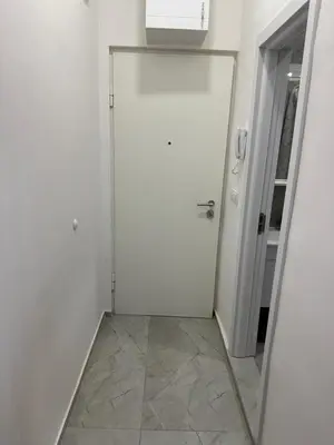 a white door in a room with a mirror at Sofija in Belgrade