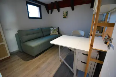 a living room with a couch and a table at Kosmaj Escape in Koraćica