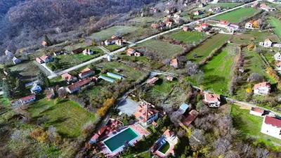 an aerial view of a village with houses at Kosmaj Escape in Koraćica
