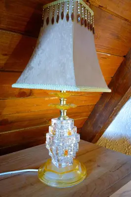a lamp sitting on top of a wooden table at Kosmaj Escape in Koraćica