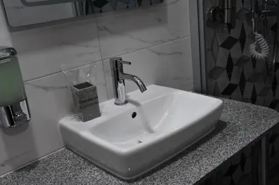 a bathroom sink with a faucet on a counter at Villa 1869 Zemun in Belgrade
