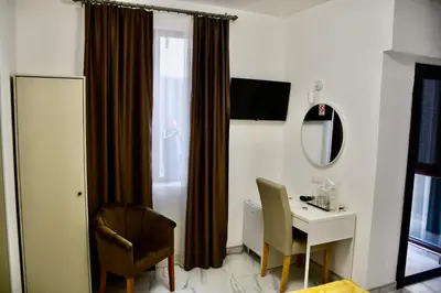 a room with a desk and a table with a mirror at Villa 1869 Zemun in Belgrade