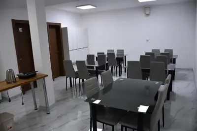 an empty room with a table and chairs at Villa 1869 Zemun in Belgrade