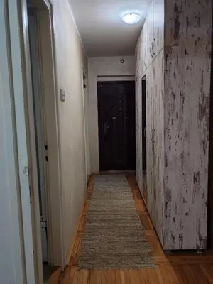 an empty hallway with a door and a rug at Signorina in Smederevo