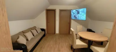 a living room with a couch and a table at Dušan in Beograd