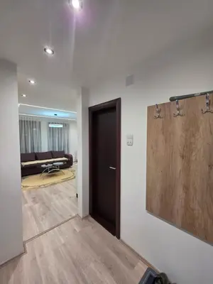 a hallway with a door and a living room at Masa in Arandjelovac