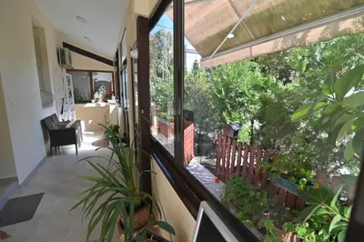 a balcony with a view of a garden at Botanical Hideout - Near Botanical Garden & City Center in Belgrade