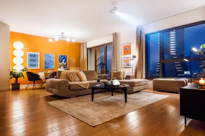 a living room with a couch and a table at WF Sky Charm with Terraces & Billiard in Belgrade