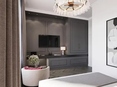 a living room with a television and a chandelier at White Gallo Residences in Belgrade