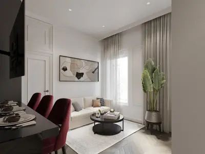 a living room with a couch and a table at White Gallo Residences in Belgrade
