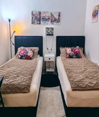 a bedroom with two beds with pillows on them at Kalemegdan 2 in Belgrade