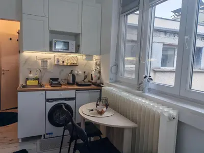 a small kitchen with a table and a sink at Kalemegdan 2 in Belgrade
