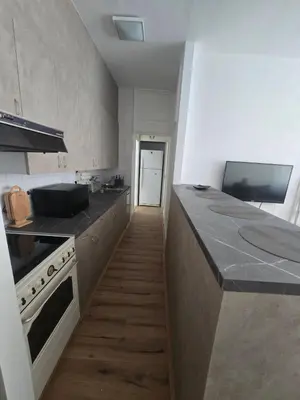 a kitchen with a stove and a counter top at The Chill Zone Kralja Petra in Belgrade
