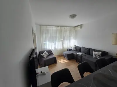 a living room with a couch and a tv at The Chill Zone Kralja Petra in Belgrade