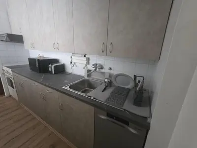 a kitchen with a sink and a counter top at The Chill Zone Kralja Petra in Belgrade