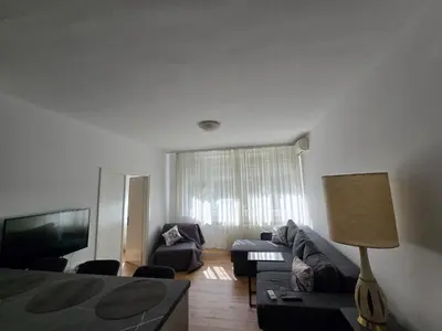 a living room with a couch and a tv at The Chill Zone Kralja Petra in Belgrade