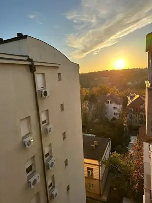 a view of the sunset from a building at Vojvoda Apartment in Belgrade