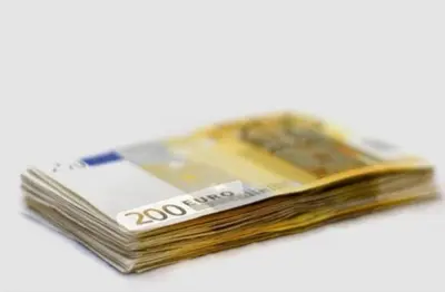 a stack of dollar bills sitting on a white background at White Queen in Belgrade